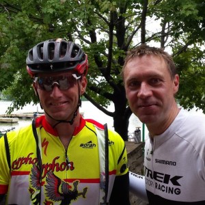 Gryphon Velo Racing rider Quentin Gniot explainins the new GVR website to Jens Voigt at Ride Across Wisconsin.